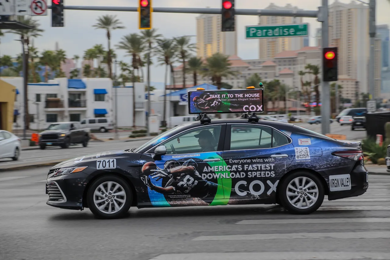 Dentsu campaign on a Firefly digital top vehicle in Las Vegas, 2024